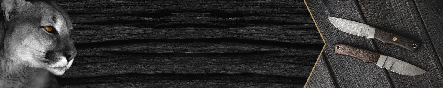 PUMA Banner Jahresmesser Damast Messer liegen auf verbranntem Holz