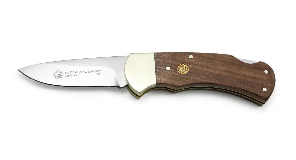 PUMA 4-Star Wood Taschenmesser geöffnet auf weißem Hintergrund, Holz-Griffschalen